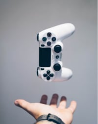 a hand catching a controller